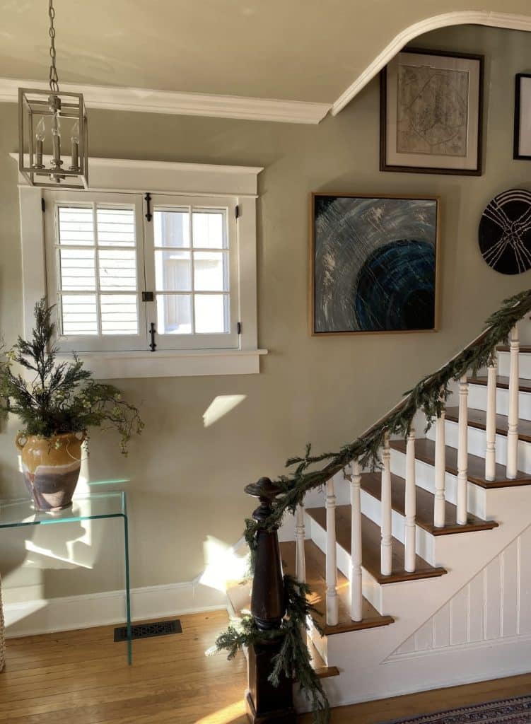 Artwork by Anne hanging up in a clients home byt the stairs